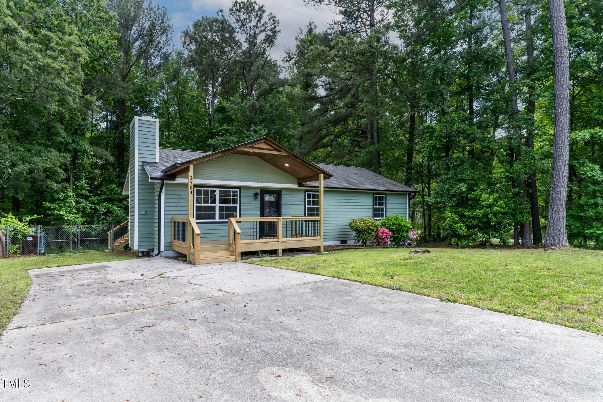 2704 Ross Road Durham, NC 27703 - Photo 2 of 28 a view of a house with a yard patio and small yard