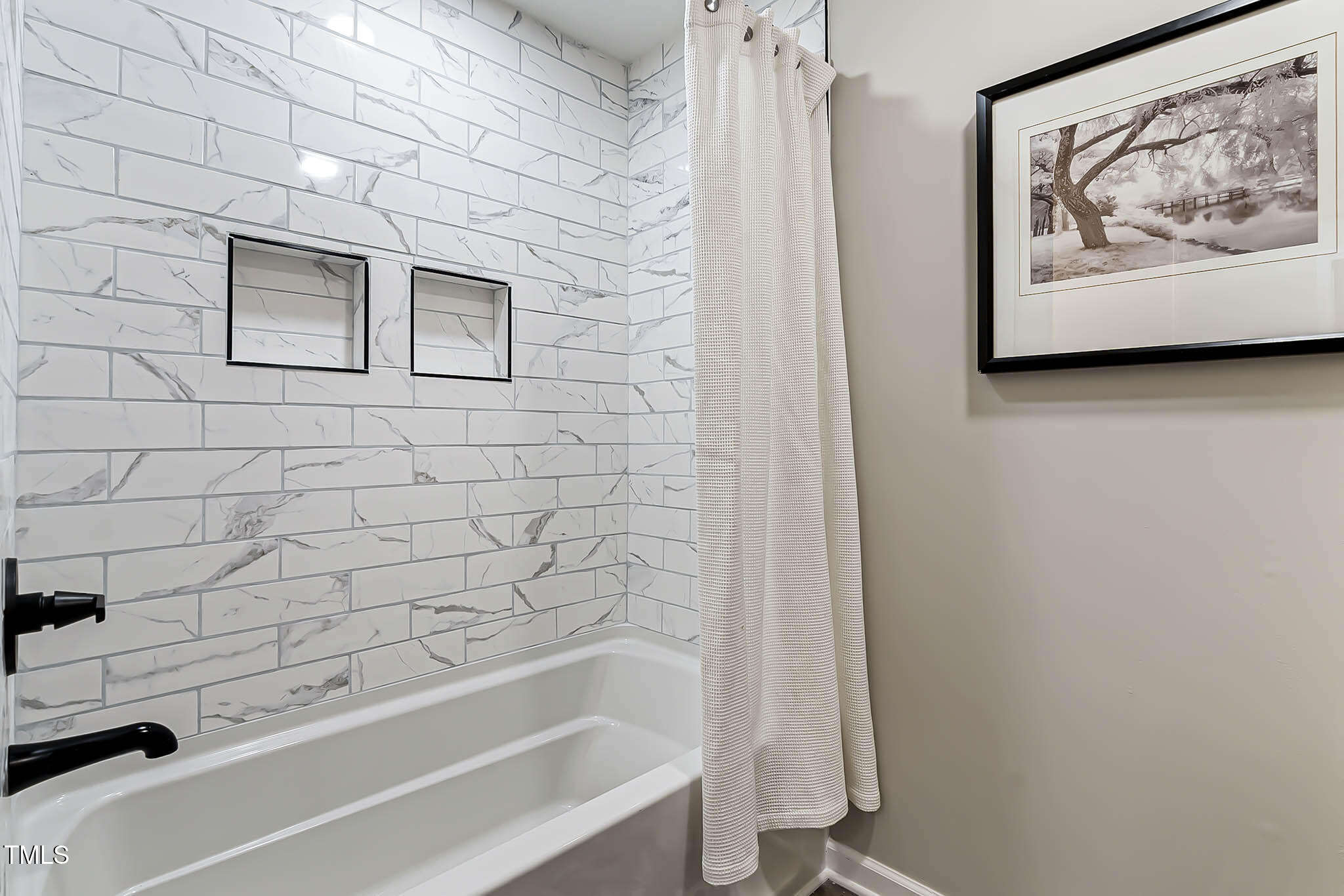 2704 Ross Road Durham, NC 27703 - Photo 21 of 28 a bathroom with a bathtub and a shower