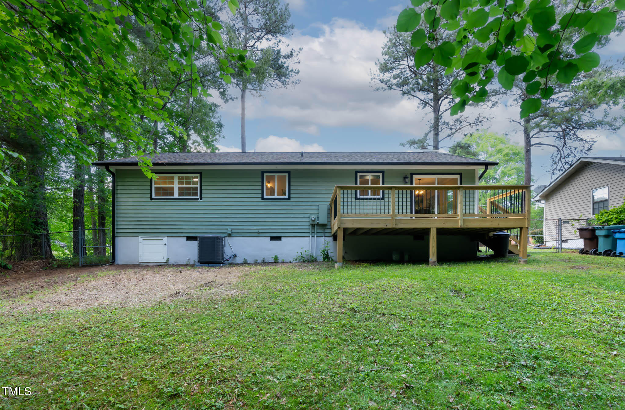 2704 Ross Road Durham, NC 27703 - Photo 22 of 28 a view of a house with a yard and a large tree