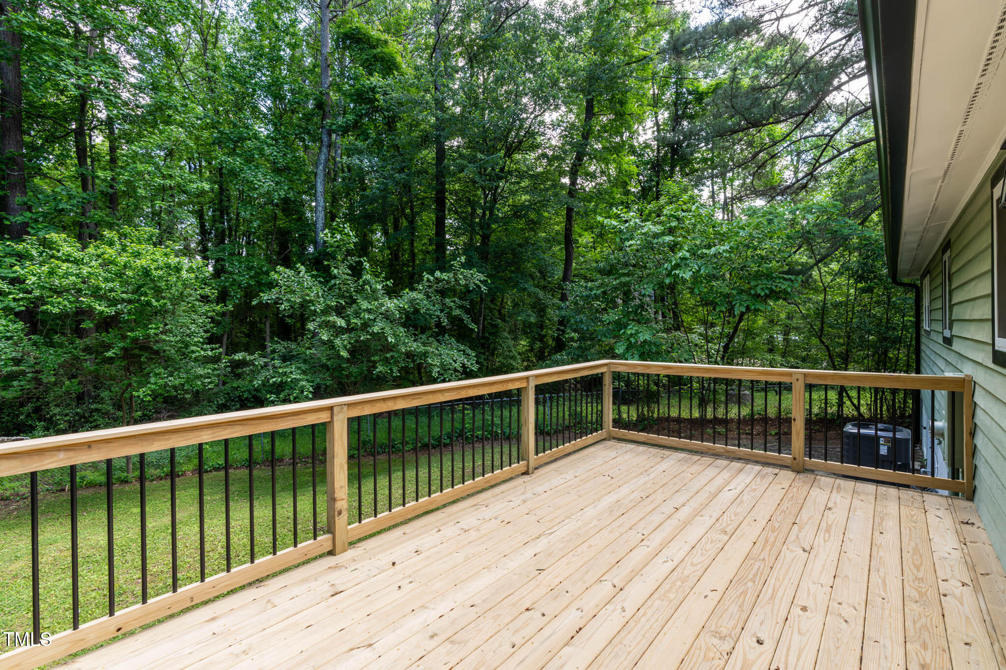 2704 Ross Road Durham, NC 27703 - Photo 24 of 28 a view of balcony with deck and trees
