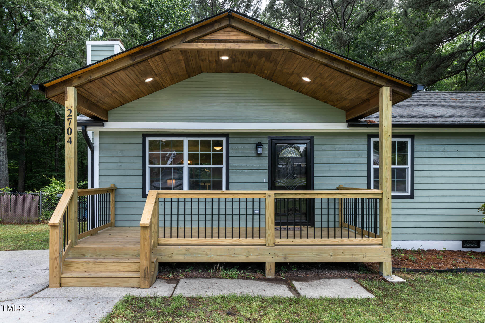 2704 Ross Road Durham, NC 27703 - Photo 3 of 28 a front view of a house with a porch