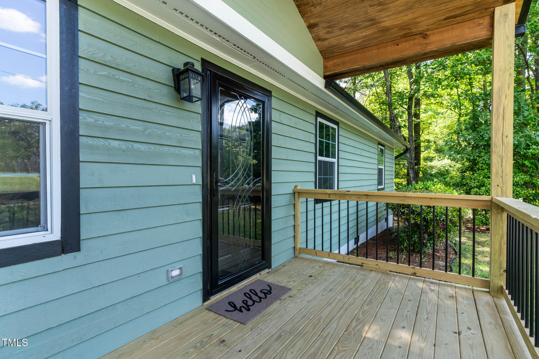 2704 Ross Road Durham, NC 27703 - Photo 4 of 28 a view of backyard with a deck and wooden floor