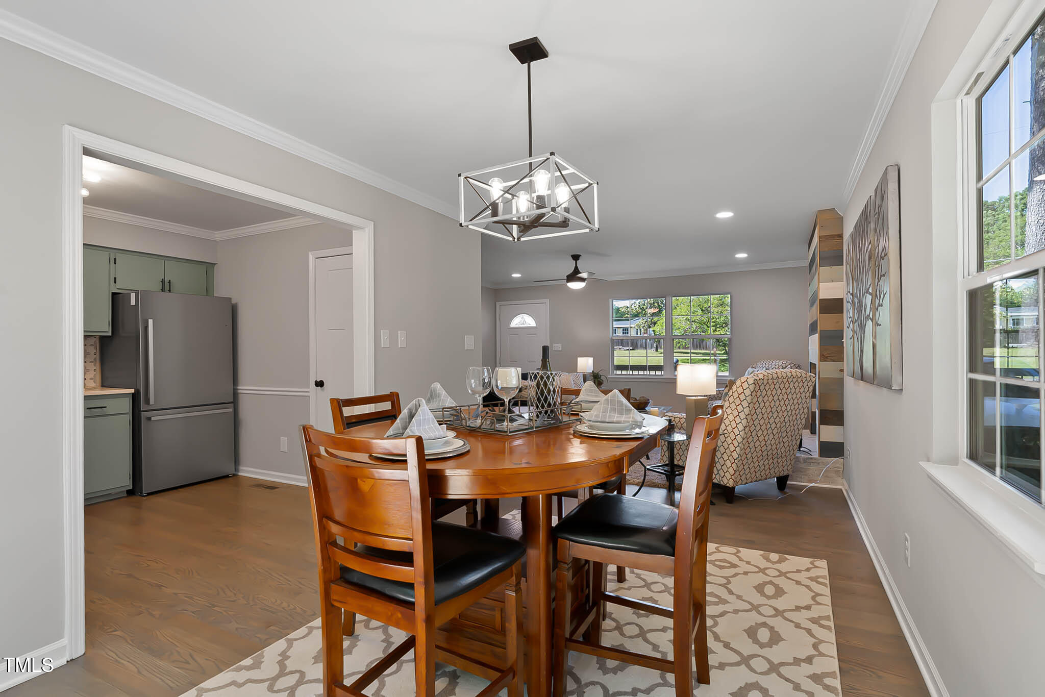 2704 Ross Road Durham, NC 27703 - Photo 9 of 28 a view of a dining room with furniture and chandelier
