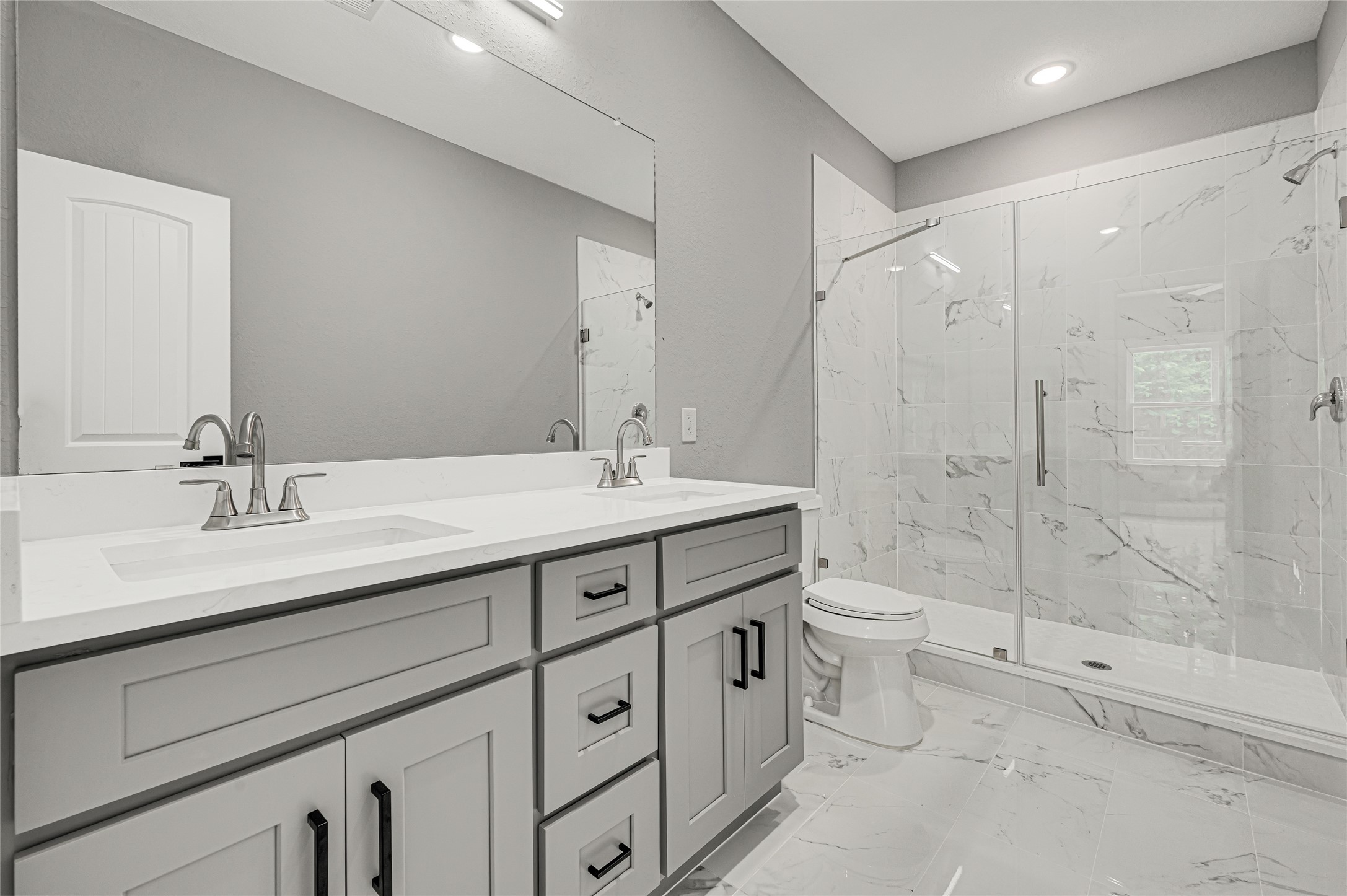 5930 Boness Road, Unit A & B Houston, TX 77396 - Photo 27 of 43 Spacious master bathroom featuring a double sink vanity and a large walk-in shower.