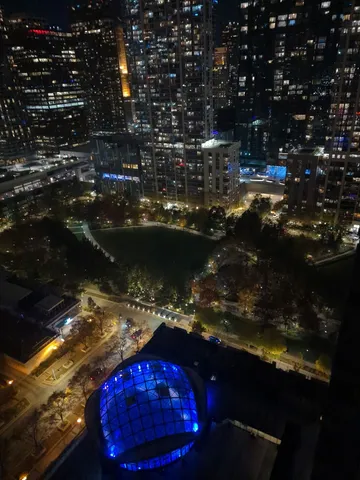a dining room with furniture and a book shelf