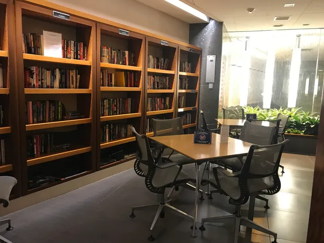 a front view of a building with table and chairs