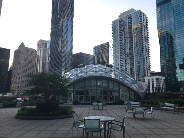 a view of an entrance to house with yard and green space