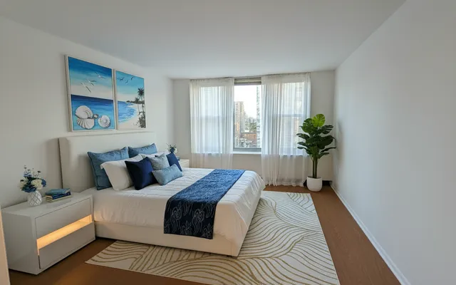 a bedroom with bed and a window