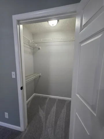 a bathroom with a toilet a sink and a mirror