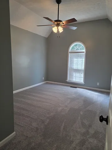 a house view with a outdoor space and garden