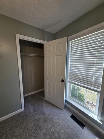 a view of a house with a yard and garage