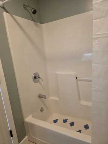 a view of staircase with white walls