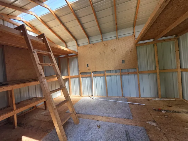 a view of a park with bench and trees