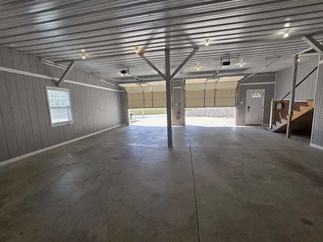 a room with lot of chandeliers and window