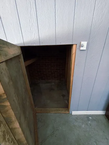a view of a roof deck with furniture
