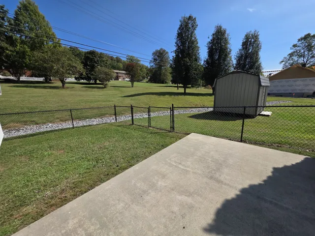 a view of a swimming pool with a patio