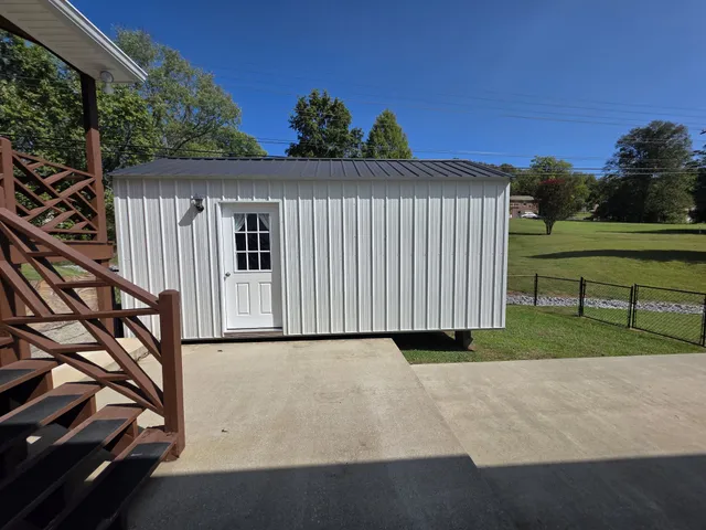 a view of swimming pool with seating area