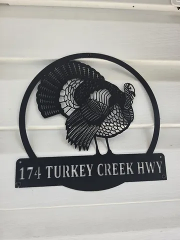 a black and white photo of a black gate