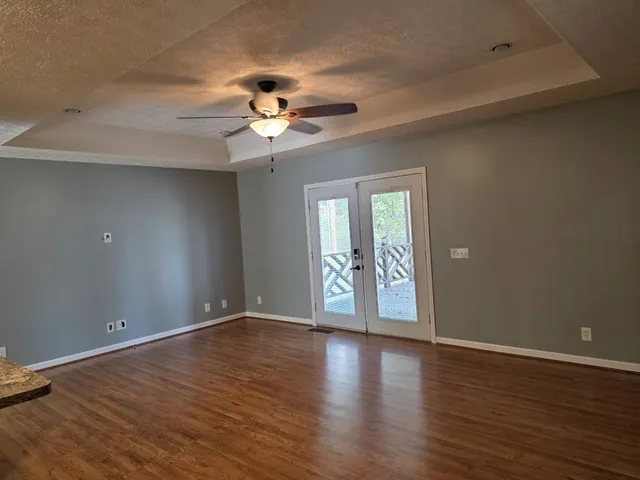 a view of a livingroom with wooden floor
