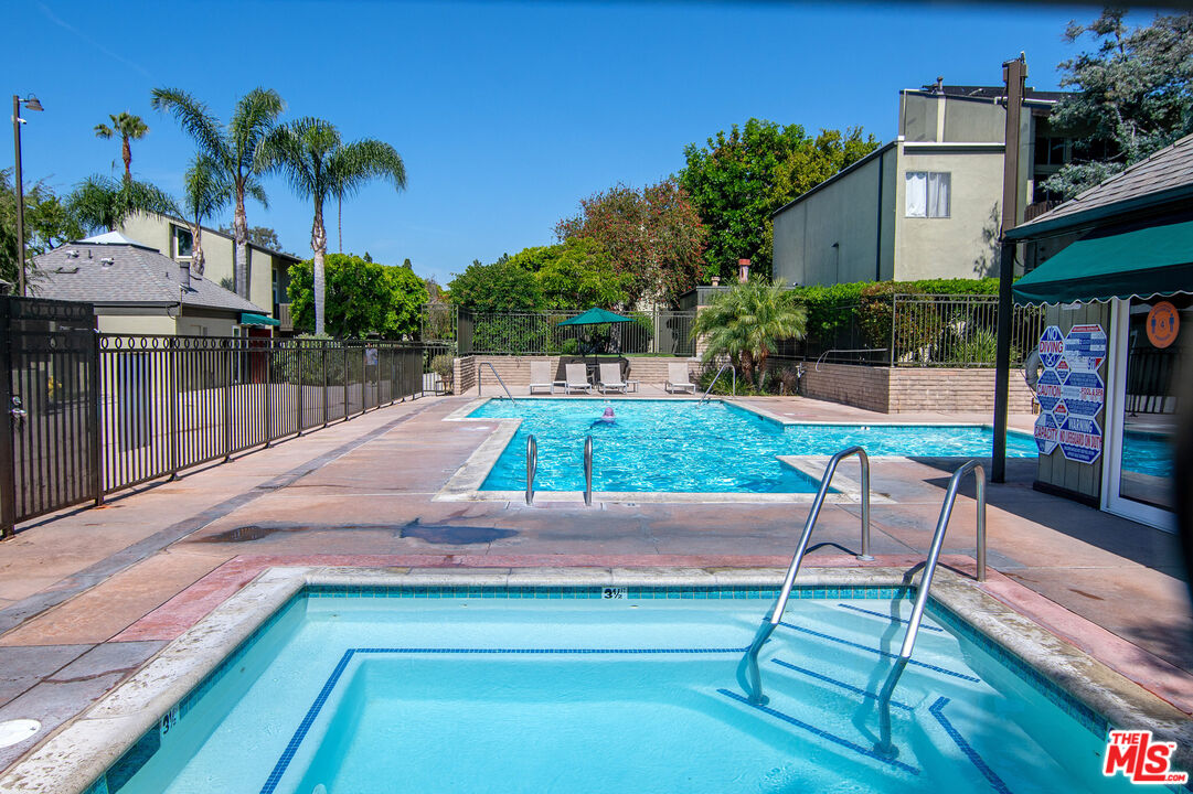 4925 Indian Wood Road, Unit 474 Culver City, CA 90230 - Photo 21 of 36 a view of a swimming pool with a patio
