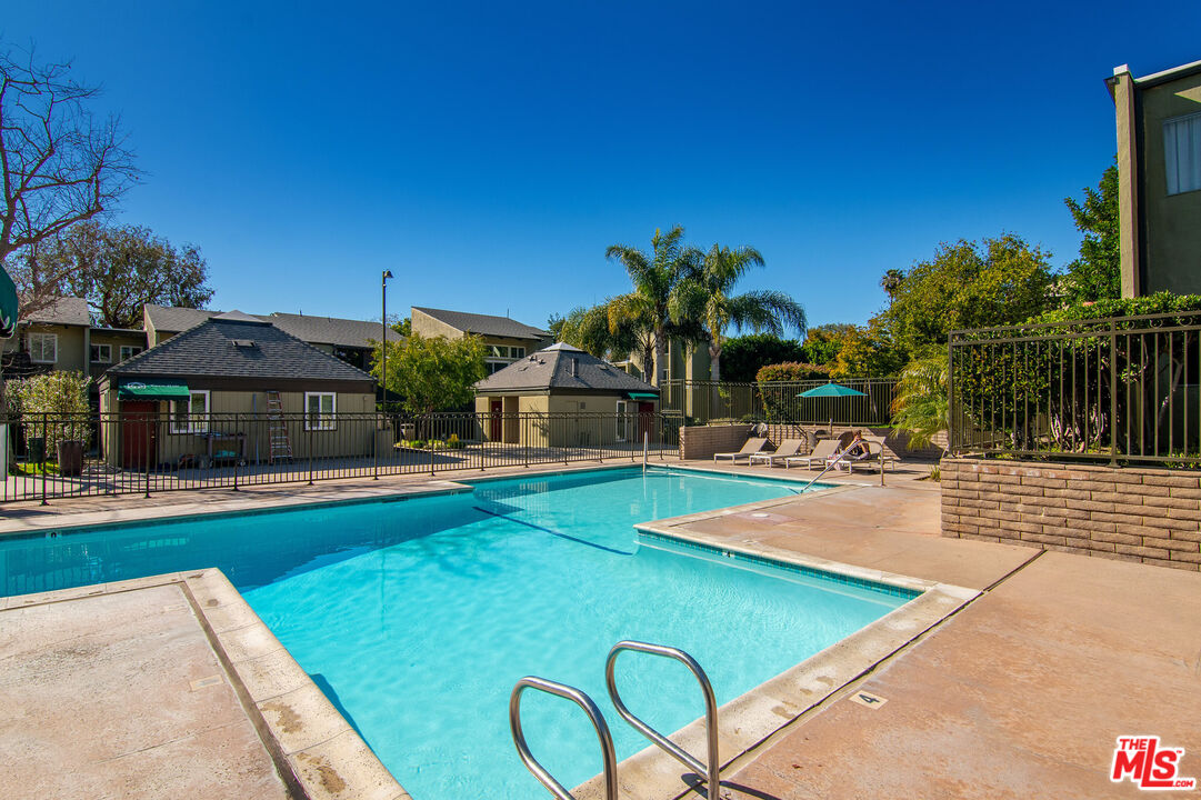 4925 Indian Wood Road, Unit 474 Culver City, CA 90230 - Photo 22 of 36 a view of a house with swimming pool