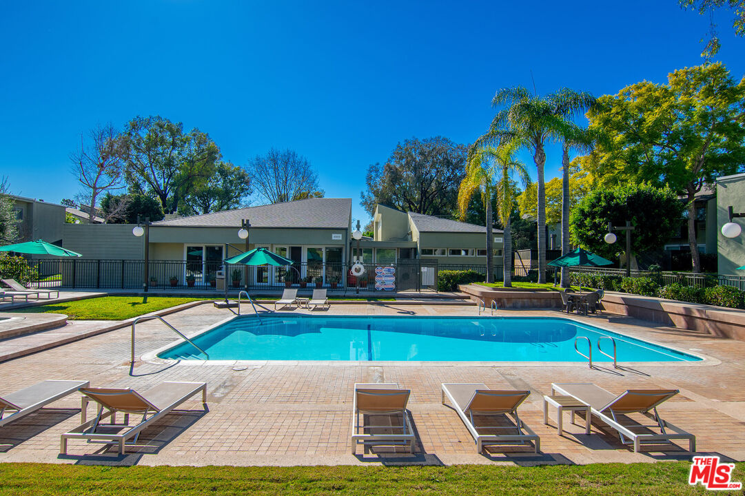 4925 Indian Wood Road, Unit 474 Culver City, CA 90230 - Photo 24 of 36 a view of swimming pool with lawn chairs and plants
