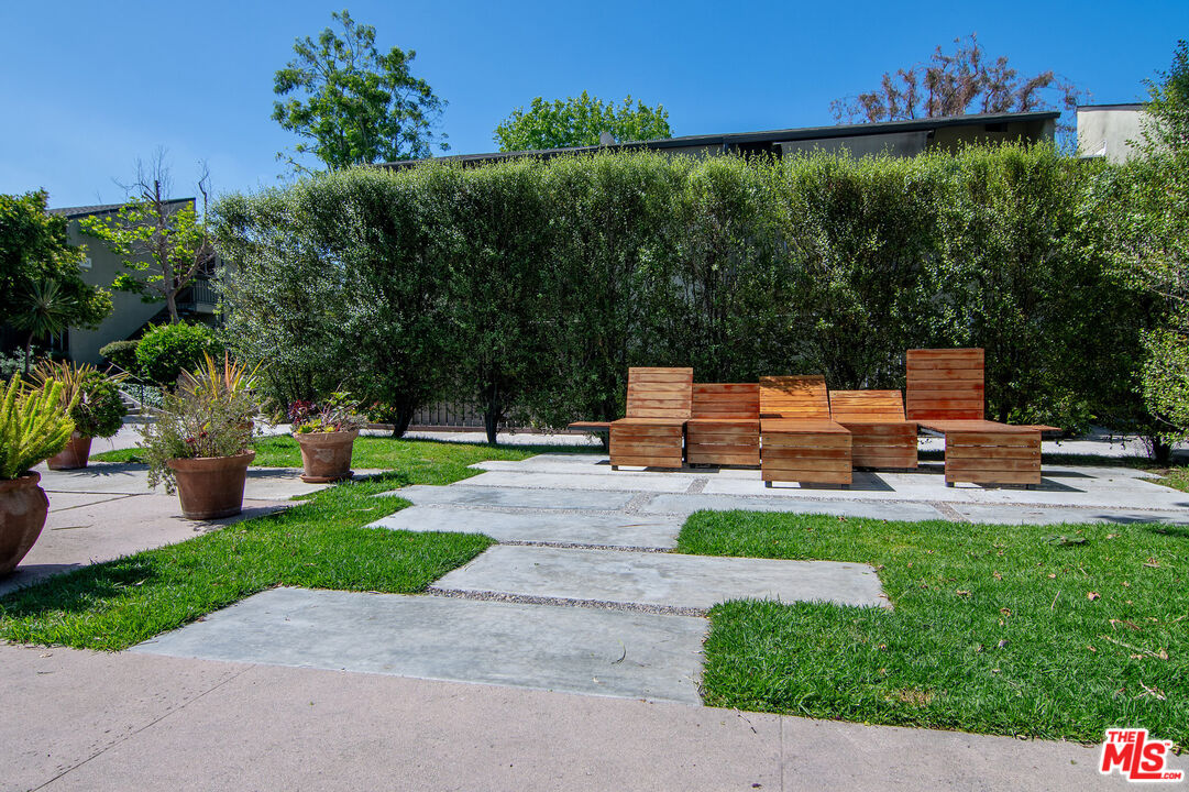 4925 Indian Wood Road, Unit 474 Culver City, CA 90230 - Photo 26 of 36 a view of a backyard with sitting area