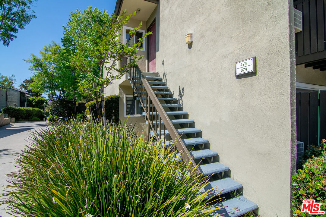4925 Indian Wood Road, Unit 474 Culver City, CA 90230 - Photo 4 of 36 a view of a yard with plants and wooden fence