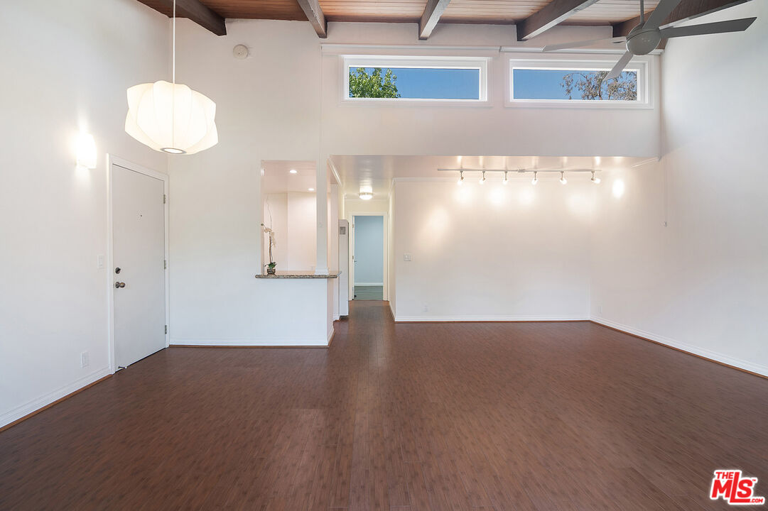 4925 Indian Wood Road, Unit 474 Culver City, CA 90230 - Photo 6 of 36 an empty room with wooden floor and windows
