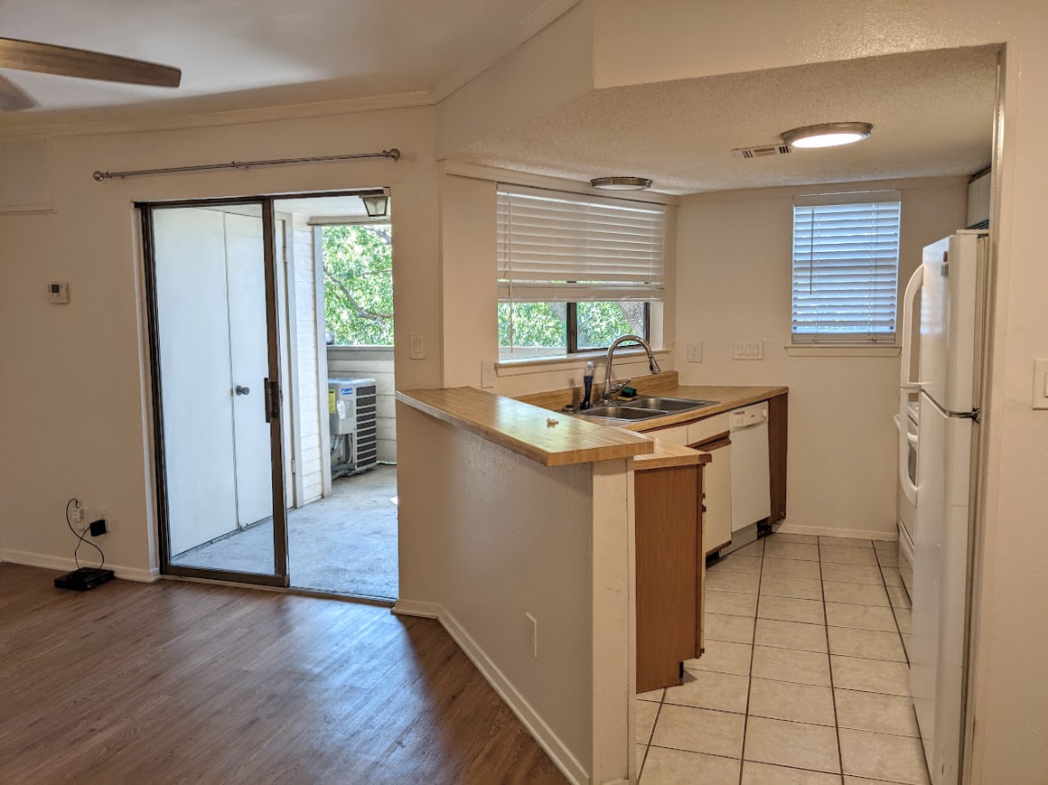 2500 Burleson Road, Unit 615 Austin, TX 78741 - Photo 6 of 13 a kitchen with sink cabinets and window