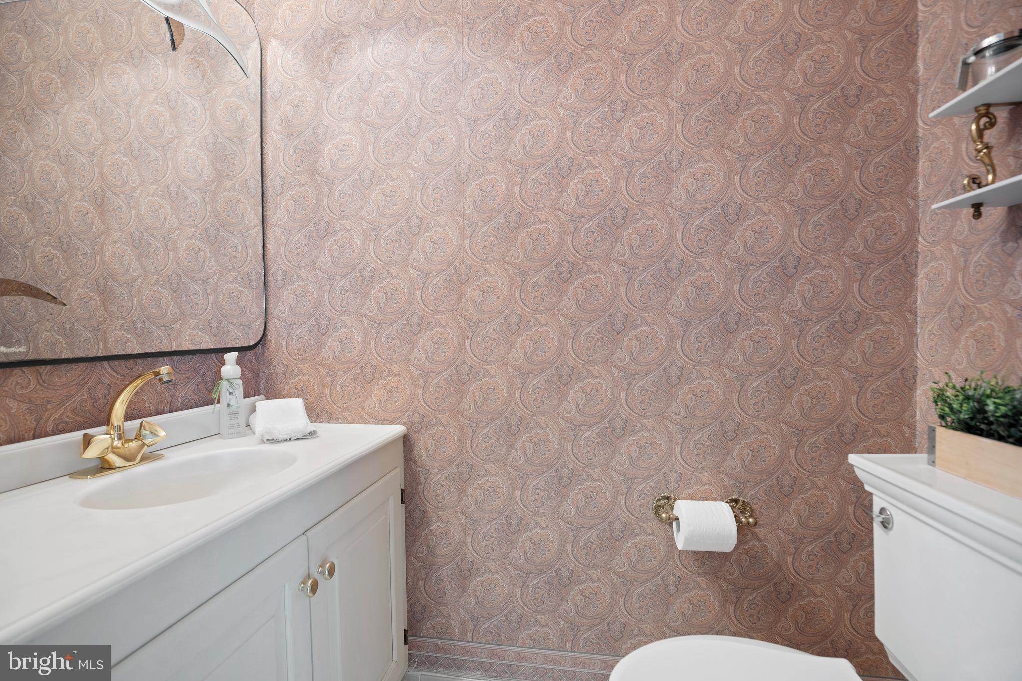 262 Coldstream Drive Berwyn, PA 19312 - Photo 15 of 45 a bathroom with a sink a toilet and a mirror