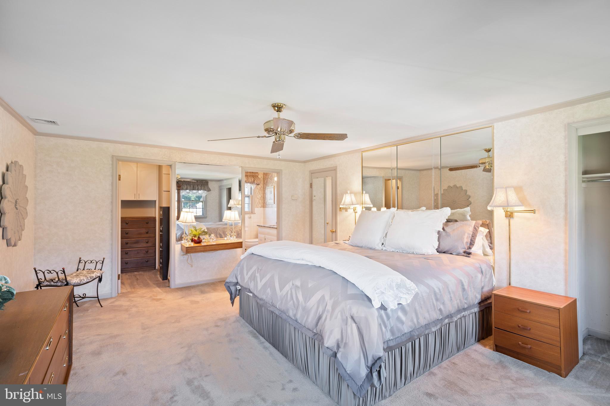 262 Coldstream Drive Berwyn, PA 19312 - Photo 18 of 45 a bedroom with a large bed a flat tv screen and dresser