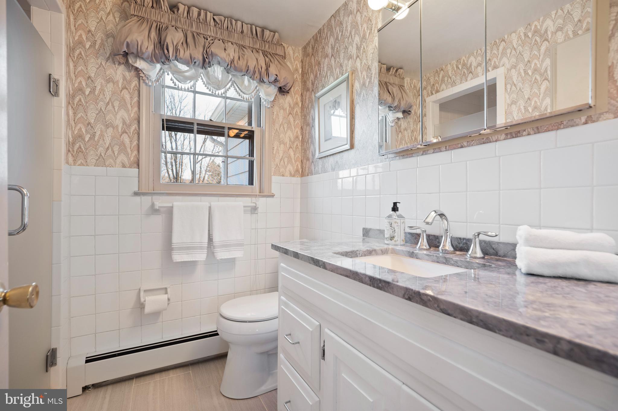 262 Coldstream Drive Berwyn, PA 19312 - Photo 21 of 45 a bathroom with a granite countertop toilet sink and mirror