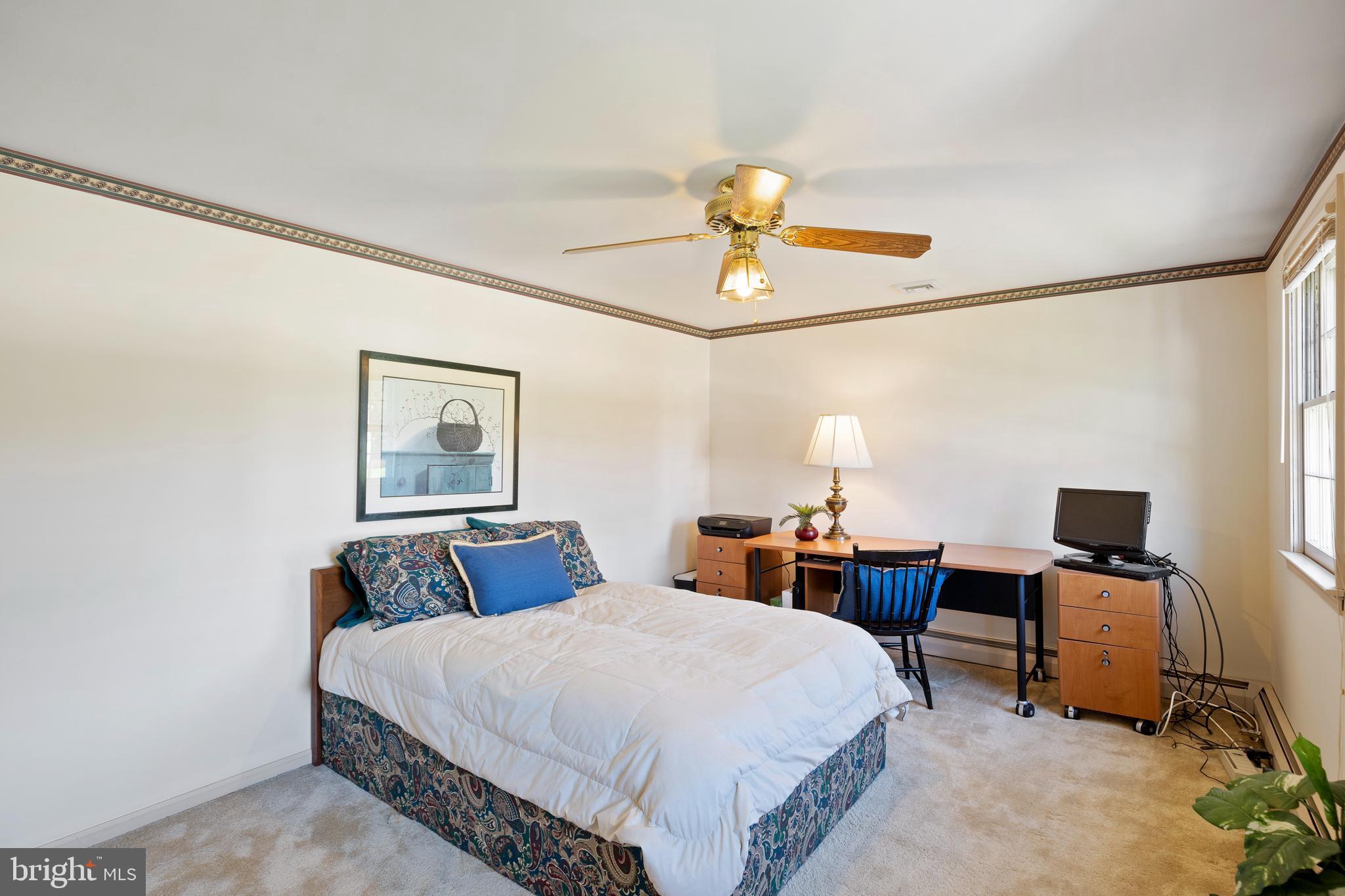 262 Coldstream Drive Berwyn, PA 19312 - Photo 25 of 45 a bedroom with a bed and a desk