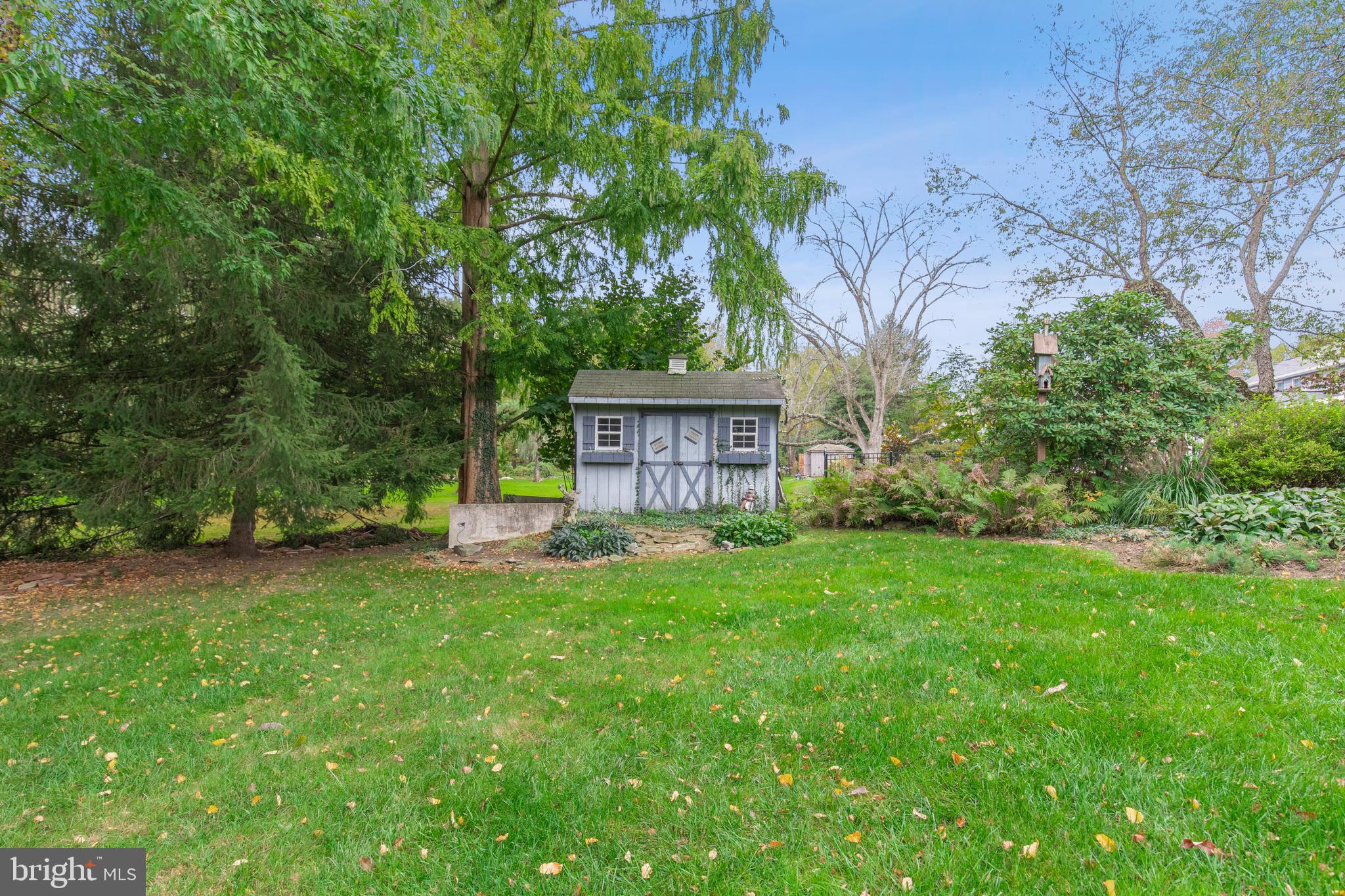262 Coldstream Drive Berwyn, PA 19312 - Photo 30 of 45 a view of a house with backyard and a garden