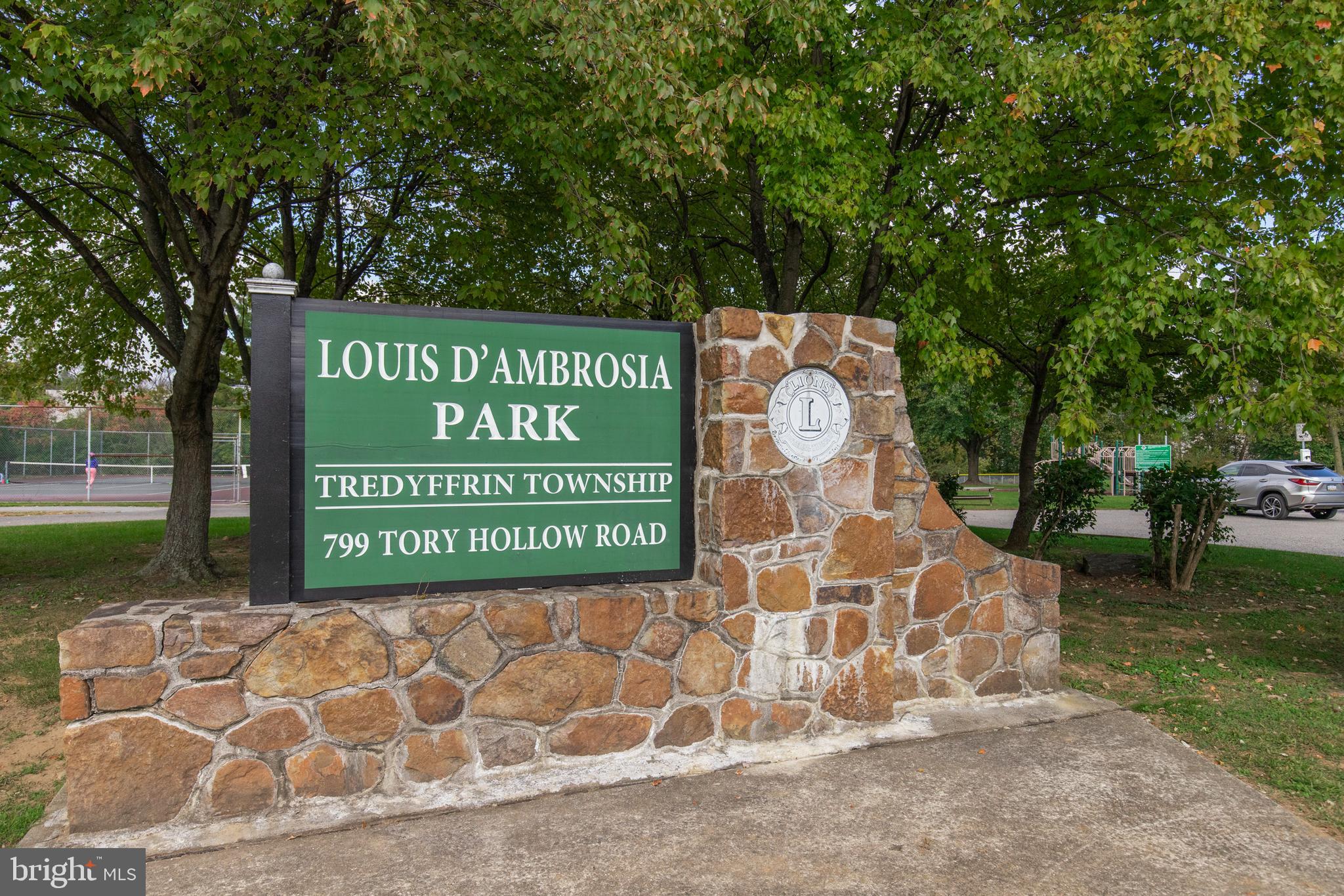 262 Coldstream Drive Berwyn, PA 19312 - Photo 35 of 45 a sign that is sitting on a brick wall