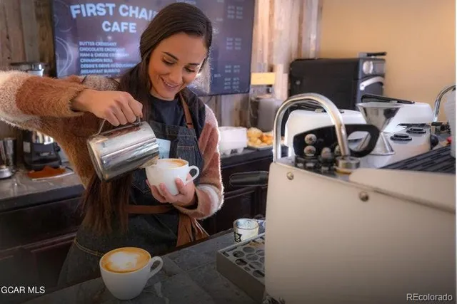 a bathroom with a sink mirror and toilet