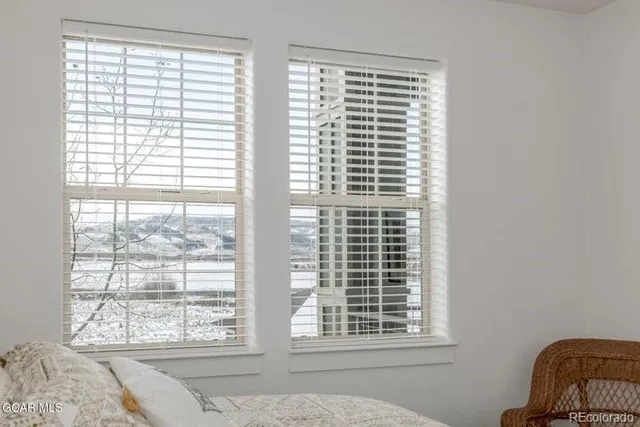 a view of a window and a chair in a room