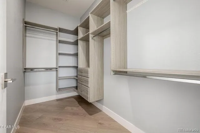 a view of an empty walk in closet