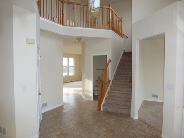 2873 Rourke Drive Aurora, IL 60503 - Photo 2 of 12 a view of entryway with stairs