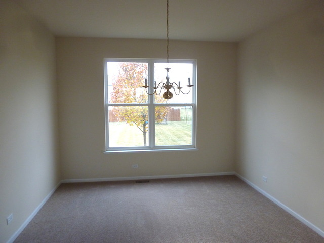 2873 Rourke Drive Aurora, IL 60503 - Photo 3 of 12 an empty room with a window