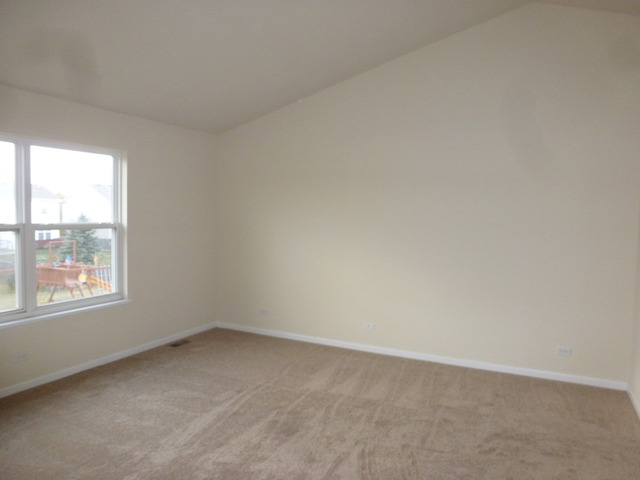 2873 Rourke Drive Aurora, IL 60503 - Photo 6 of 12 an empty room with a window