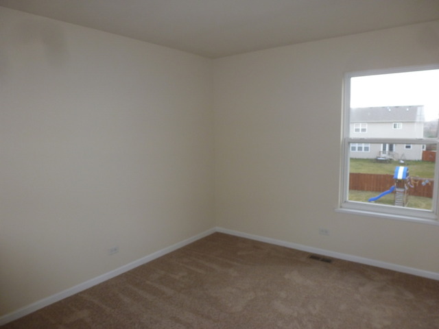 2873 Rourke Drive Aurora, IL 60503 - Photo 8 of 12 an empty room with a window