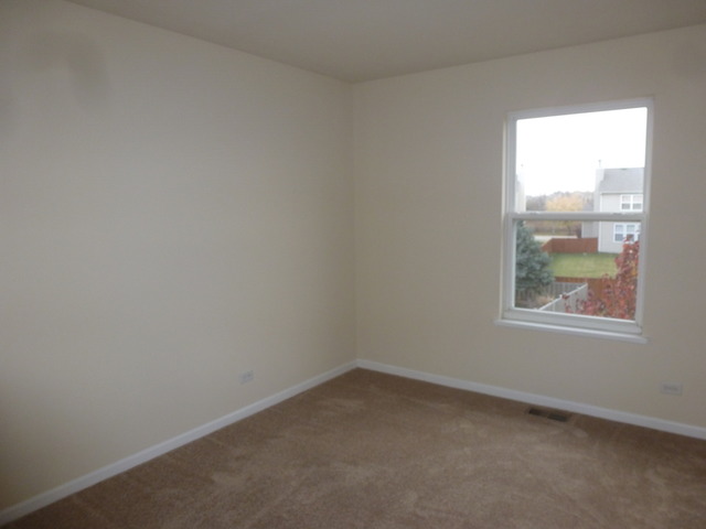 2873 Rourke Drive Aurora, IL 60503 - Photo 9 of 12 an empty room with a window