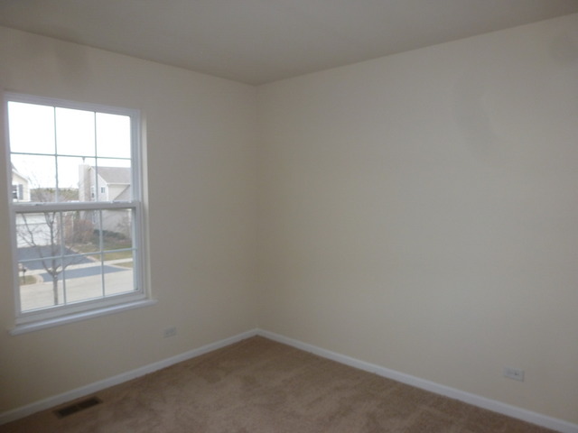 2873 Rourke Drive Aurora, IL 60503 - Photo 10 of 12 an empty room with a window