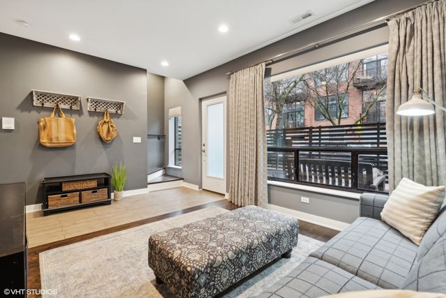 a bedroom with furniture and a window