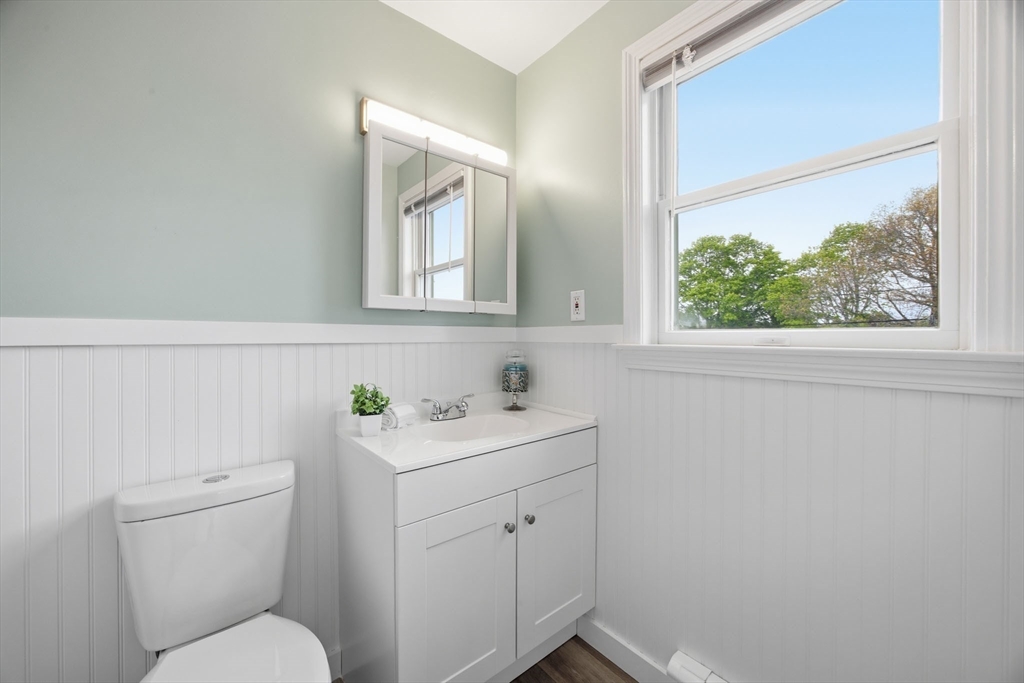 192 Swifts Beach Road Wareham, MA 02571 - Photo 34 of 38 a bathroom with a toilet sink and mirror