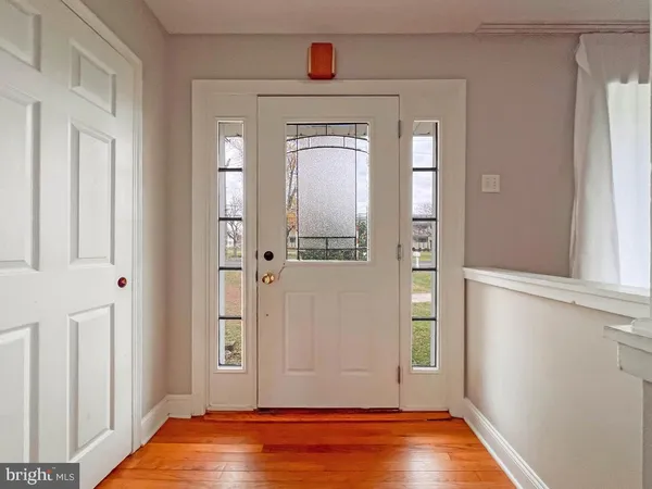 hallway view with wooden floor