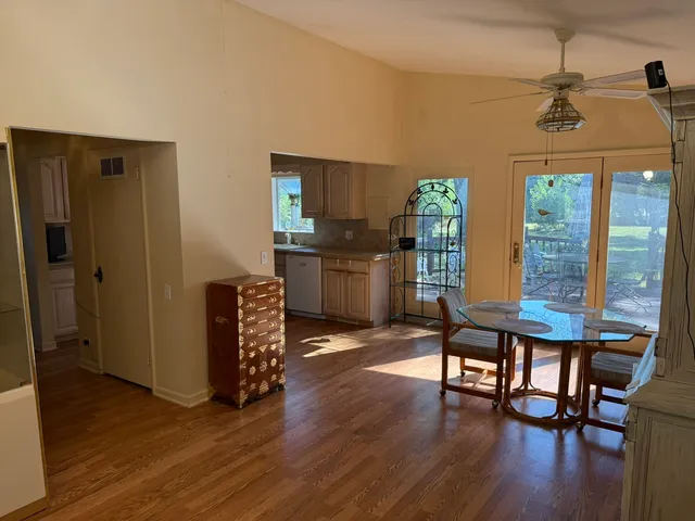 a view of a livingroom with furniture and hardwood floor