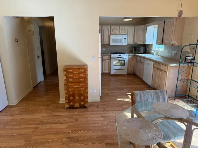 a kitchen with stainless steel appliances granite countertop a refrigerator sink and cabinets